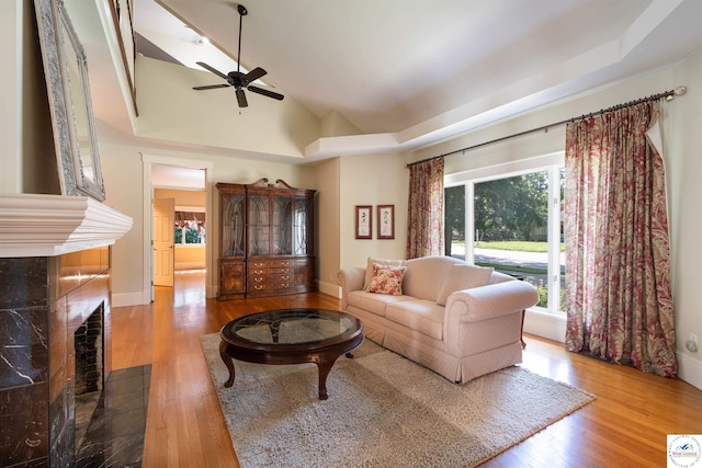 1114 W Broadway Blvd, Sedalia, MO 65301 - living area with a ceiling fan, wood finished floors, lofted ceiling, and a fireplace