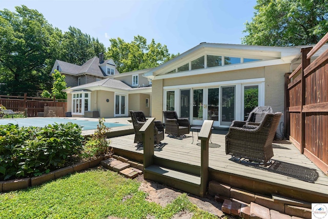 1114 W Broadway Blvd, Sedalia, MO 65301 - back of house with french doors, a wooden deck, and brick siding