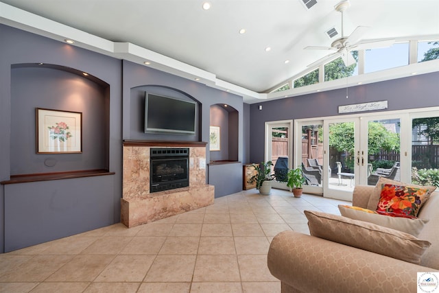 1114 W Broadway Blvd, Sedalia, MO 65301 - living room with ceiling fan, recessed lighting, light tile patterned flooring, a high end fireplace, and french doors