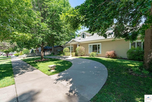 1114 W Broadway Blvd, Sedalia, MO 65301 - view of front of home featuring a front lawn and stucco siding