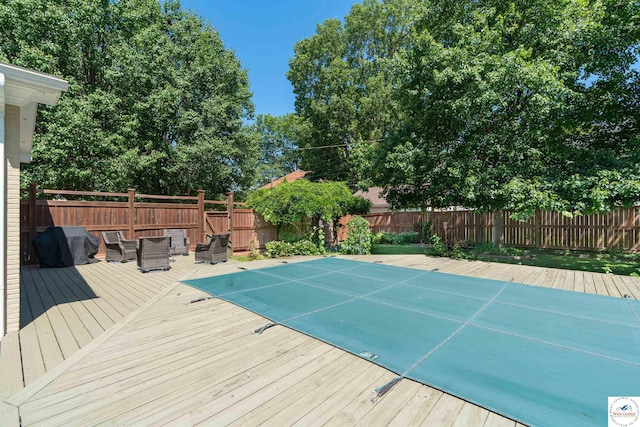1114 W Broadway Blvd, Sedalia, MO 65301 - view of swimming pool featuring a fenced backyard, a deck, and grilling area