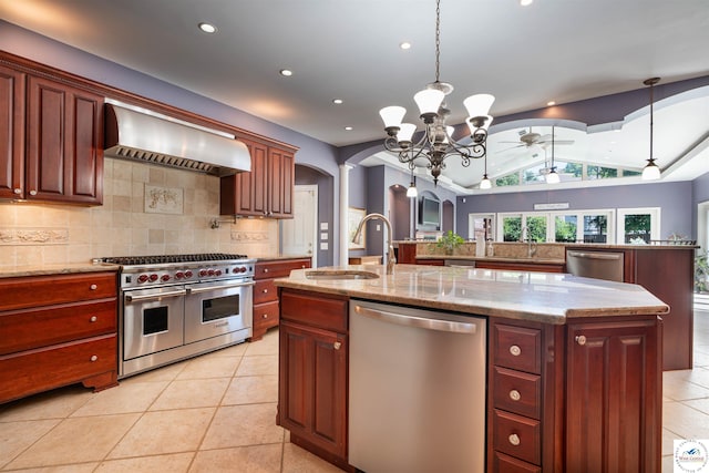 1114 W Broadway Blvd, Sedalia, MO 65301 - kitchen featuring appliances with stainless steel finishes, custom range hood, arched walkways, a kitchen island with sink, and a ceiling fan
