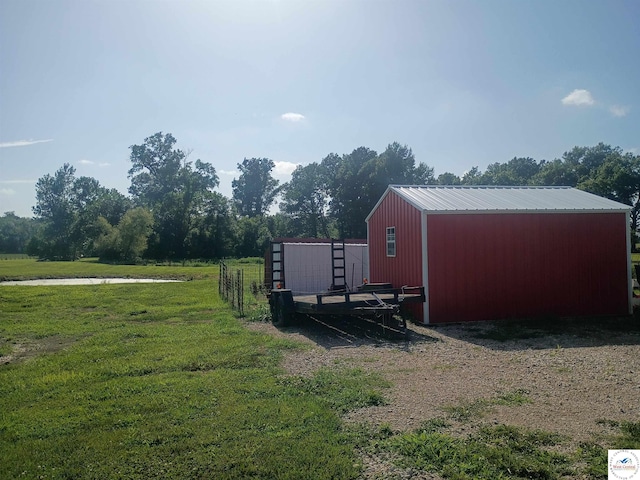 30512 S Hess Rd, Harrisonville, MO 64701 - view of green lawn featuring a pole building and an outdoor structure