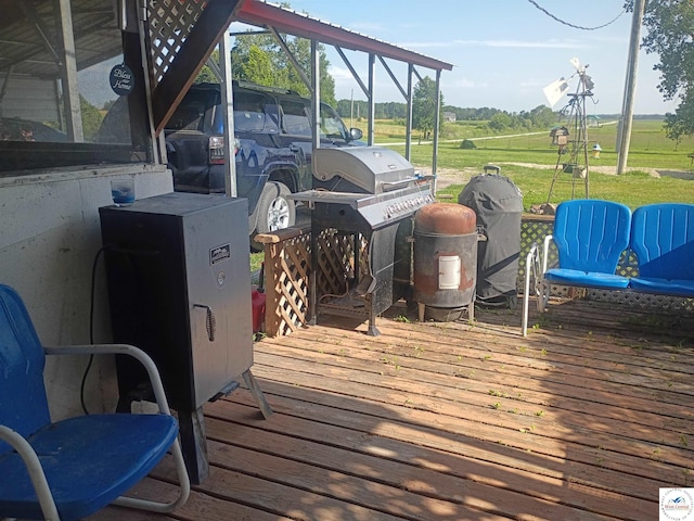 30512 S Hess Rd, Harrisonville, MO 64701 - wooden deck with area for grilling and a lawn