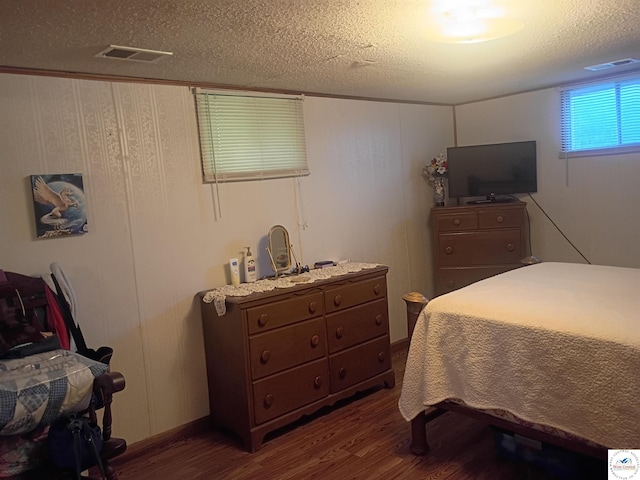 30512 S Hess Rd, Harrisonville, MO 64701 - bedroom featuring dark wood finished floors and a textured ceiling