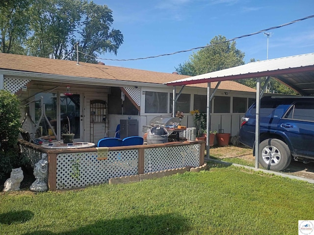 30512 S Hess Rd, Harrisonville, MO 64701 - rear view of house with a lawn and roof with shingles