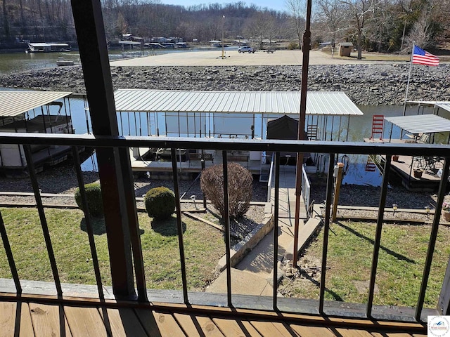 view of swimming pool featuring a dock and a water view