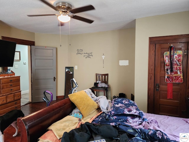 bedroom featuring ceiling fan and wood finished floors