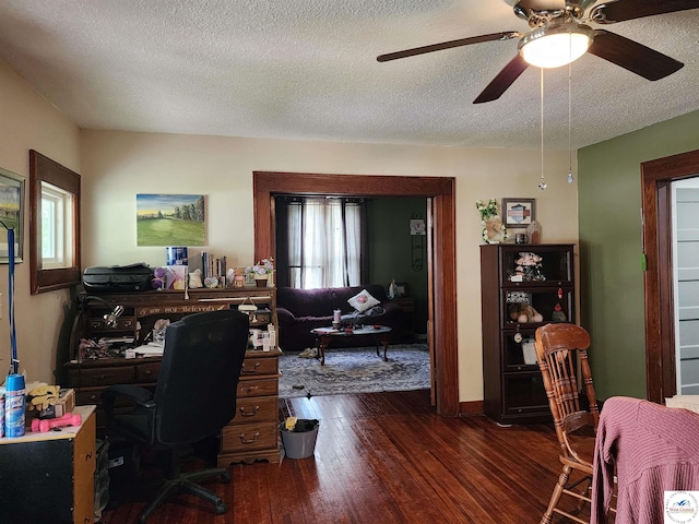 office space featuring ceiling fan, a textured ceiling, and dark wood-type flooring