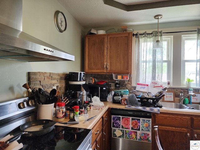 kitchen with wall chimney range hood, backsplash, black microwave, brown cabinets, and stainless steel range with electric cooktop