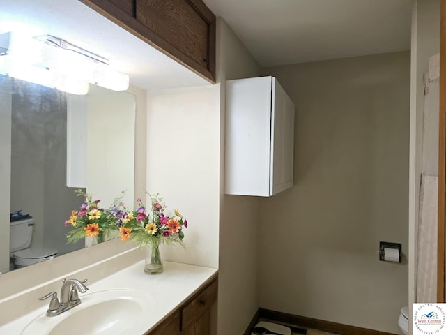 502 S Ferguson Ave, Tipton, MO 65081 - half bathroom featuring vanity and toilet