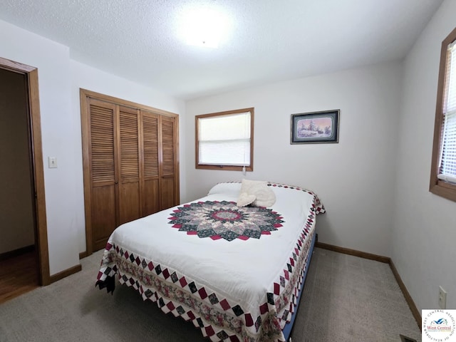 502 S Ferguson Ave, Tipton, MO 65081 - bedroom featuring baseboards, light colored carpet, and a closet