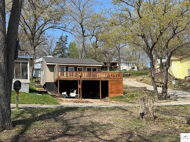 back of property with a wooden deck