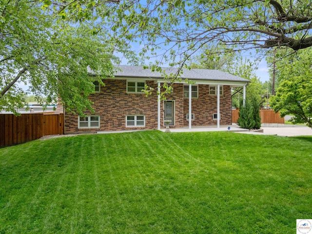 321 E 17th St, Sedalia, MO 65301 - back of property with a patio area