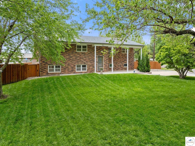 321 E 17th St, Sedalia, MO 65301 - rear view of house with a patio