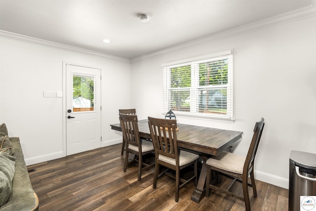 321 E 17th St, Sedalia, MO 65301 - dining area with crown molding, dark wood-style flooring, plenty of natural light, and baseboards