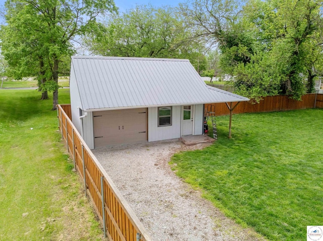 321 E 17th St, Sedalia, MO 65301 - view of outbuilding with a garage and driveway