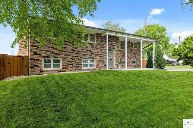 321 E 17th St, Sedalia, MO 65301 - rear view of property featuring brick siding