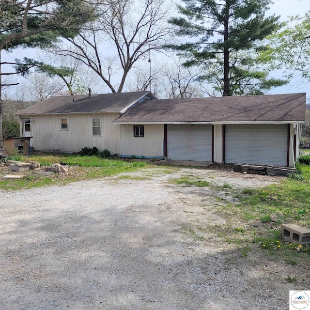 view of home's exterior featuring dirt driveway
