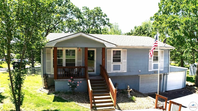 715 Hickory St, Warsaw, MO 65355 - single story home with roof with shingles, covered porch, stairs, and a garage