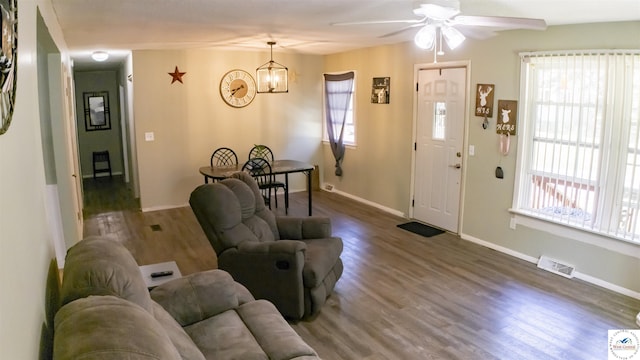 715 Hickory St, Warsaw, MO 65355 - living room with a chandelier, wood finished floors, ceiling fan, and baseboards