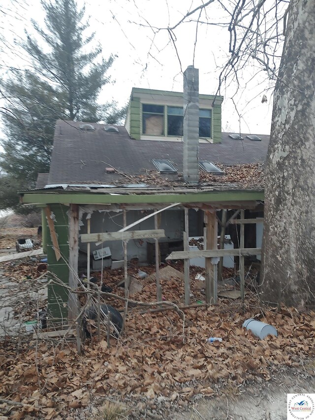 view of side of property featuring a chimney