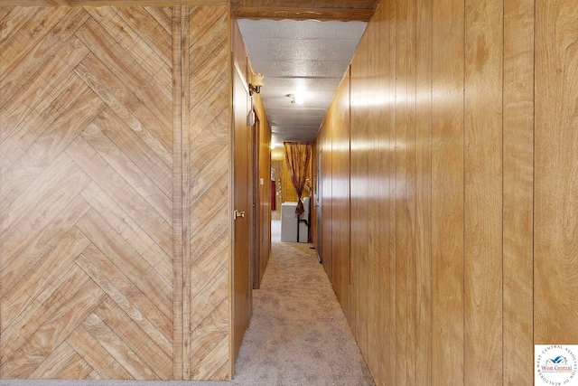 corridor with wood walls and carpet