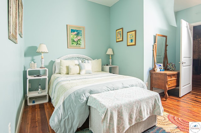 304 W Main St, Sedalia, MO 65301 - bedroom featuring baseboards and hardwood / wood-style floors
