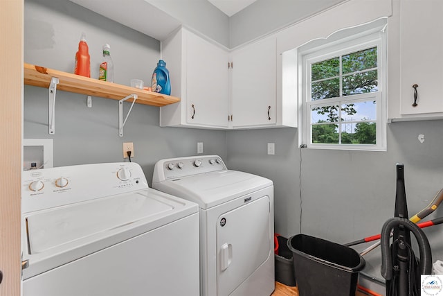 810 Harris St, Clinton, MO 64735 - washroom featuring cabinet space and separate washer and dryer