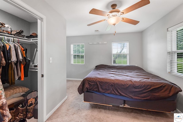 810 Harris St, Clinton, MO 64735 - bedroom with carpet floors, baseboards, a closet, ceiling fan, and a spacious closet