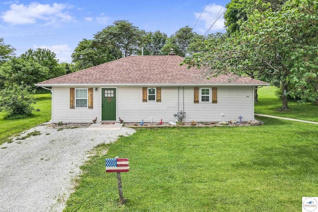 810 Harris St, Clinton, MO 64735 - view of front facade featuring a front lawn and roof with shingles