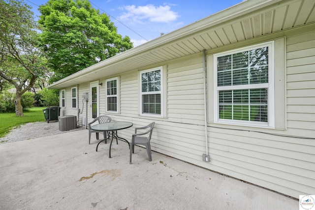 810 Harris St, Clinton, MO 64735 - view of patio featuring central AC unit