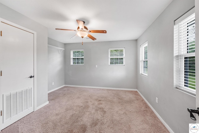 810 Harris St, Clinton, MO 64735 - carpeted empty room featuring a ceiling fan and baseboards