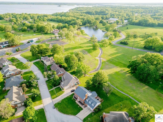 drone / aerial view with a residential view and a water view