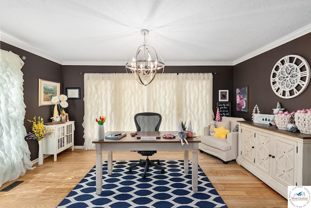 office area featuring crown molding, a chandelier, visible vents, baseboards, and light wood-type flooring