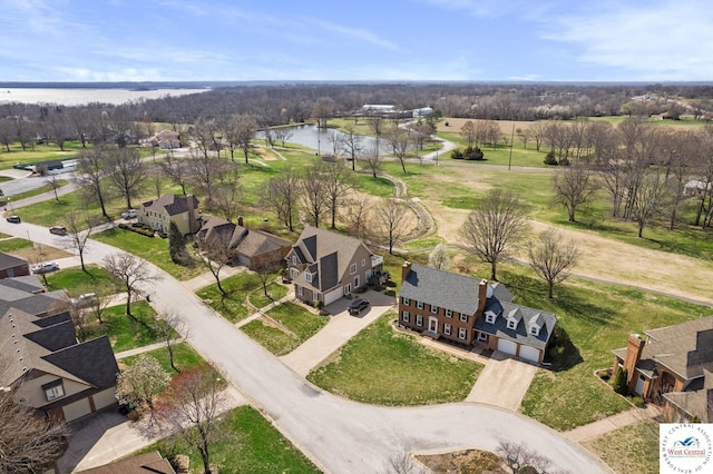 drone / aerial view with a residential view and a water view