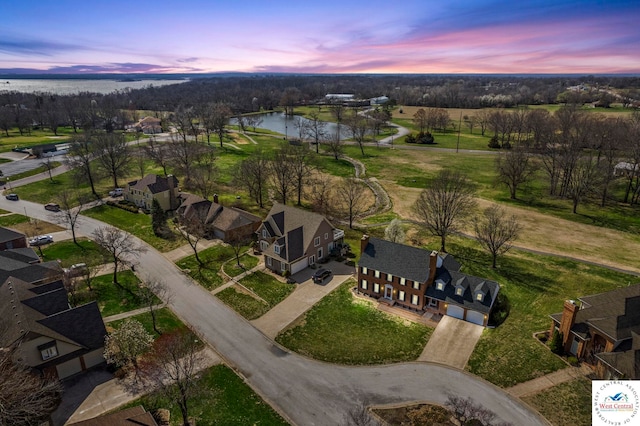 bird's eye view with a residential view and a water view