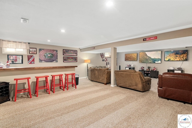 living area featuring visible vents, recessed lighting, and carpet floors