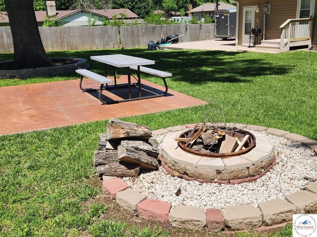 810 E Cedar St, Clinton, MO 64735 - view of yard featuring a fire pit and a patio area
