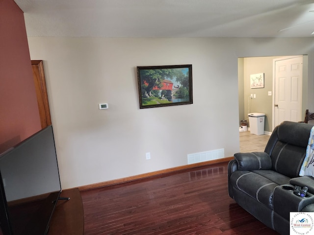 810 E Cedar St, Clinton, MO 64735 - living area with wood finished floors and baseboards