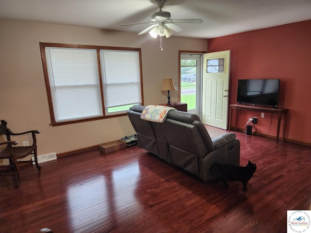 810 E Cedar St, Clinton, MO 64735 - living area featuring ceiling fan, hardwood / wood-style flooring, and baseboards
