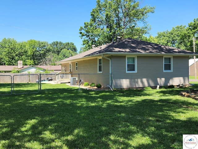 810 E Cedar St, Clinton, MO 64735 - rear view of house featuring central AC unit and a gate