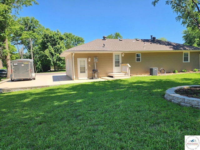 810 E Cedar St, Clinton, MO 64735 - back of house featuring a patio area, a yard, and central AC unit