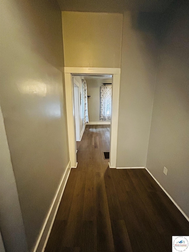 902 N 2nd St, Clinton, MO 64735 - corridor featuring dark wood finished floors and baseboards