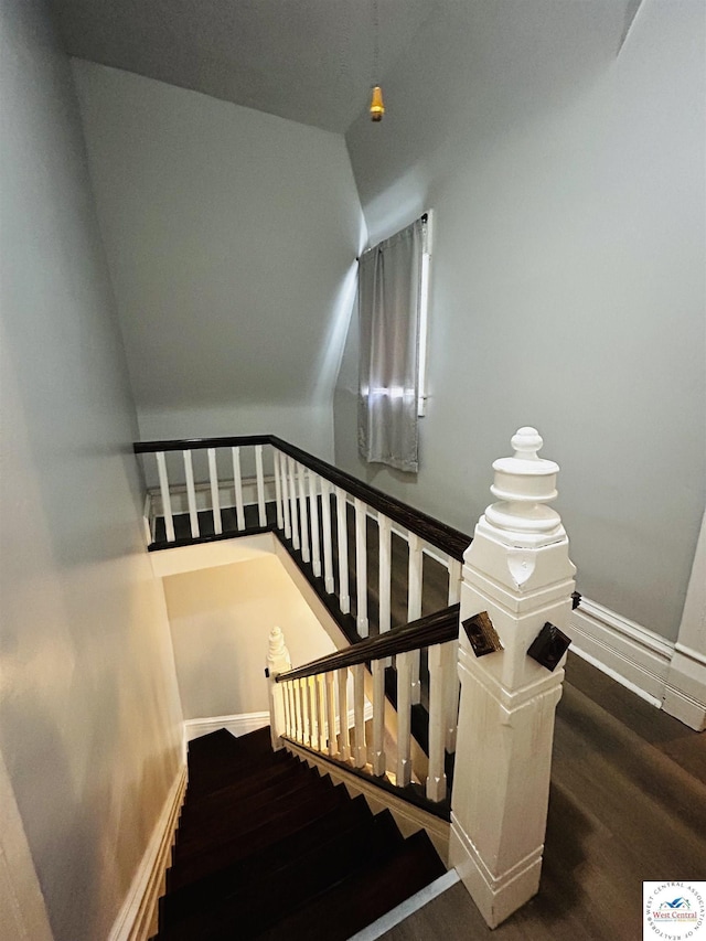 902 N 2nd St, Clinton, MO 64735 - stairs featuring wood finished floors, baseboards, and vaulted ceiling