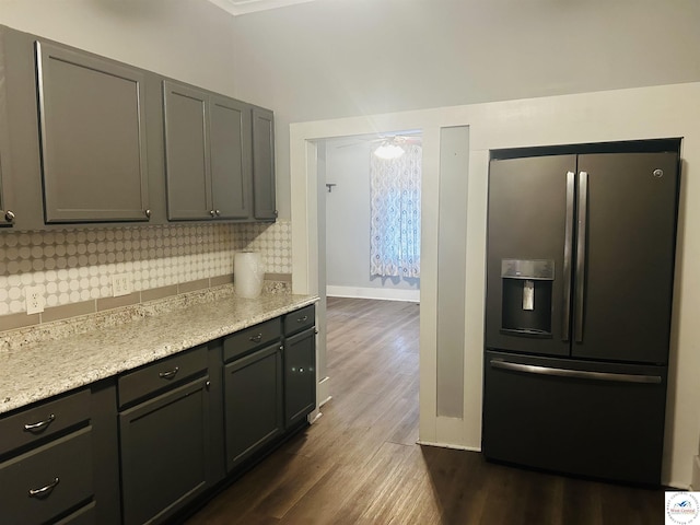 902 N 2nd St, Clinton, MO 64735 - kitchen with stainless steel refrigerator with ice dispenser, dark wood-type flooring, and tasteful backsplash