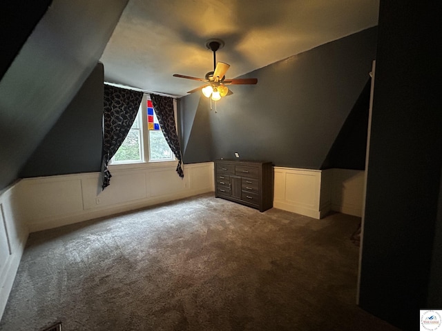 902 N 2nd St, Clinton, MO 64735 - bonus room with a ceiling fan, carpet floors, lofted ceiling, wainscoting, and a decorative wall