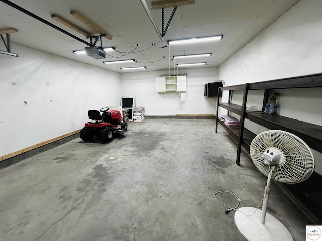 902 N 2nd St, Clinton, MO 64735 - garage with baseboards and a garage door opener
