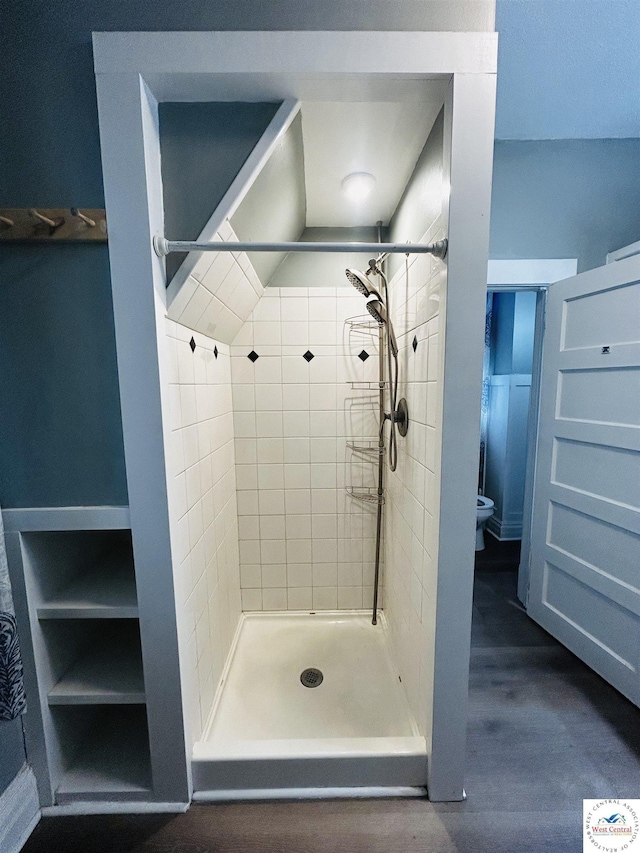 902 N 2nd St, Clinton, MO 64735 - bathroom with a shower stall, toilet, and wood finished floors