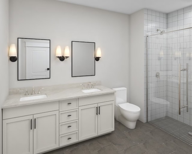 bathroom with double vanity, a sink, a stall shower, and toilet